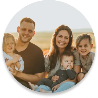 Happy family sitting together with smiling faces.